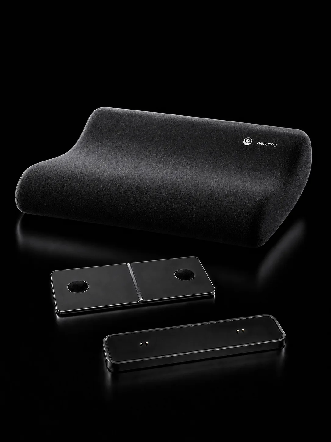 Neruma contour pillow with its removable stereo pod and magnetic charging dock